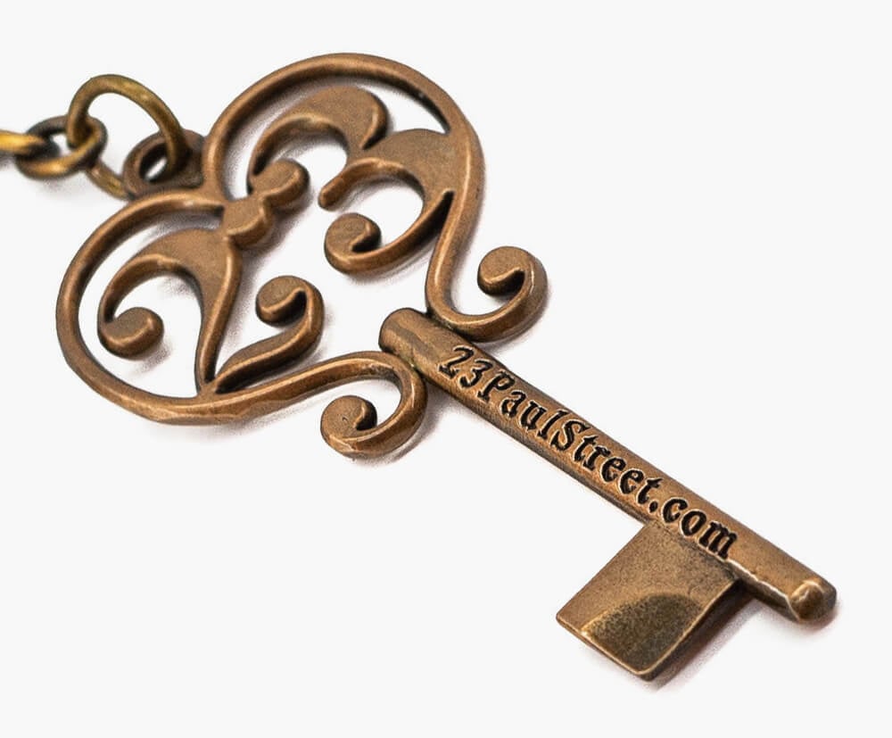 Standard sized customised key-shaped promotional keyring.