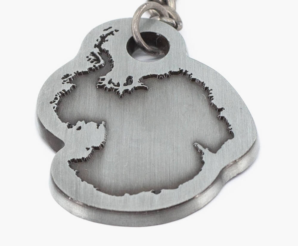 2D, flat faced keyring with embossed details.