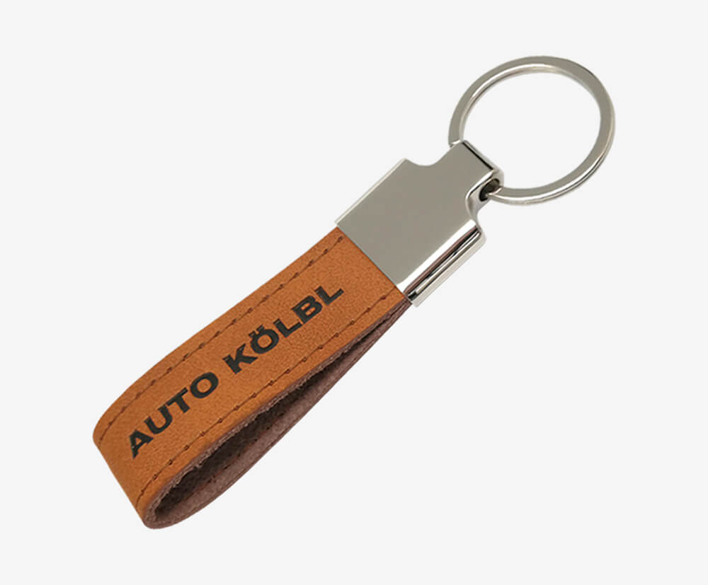 Crafted leather strap keyring with printed branding.
