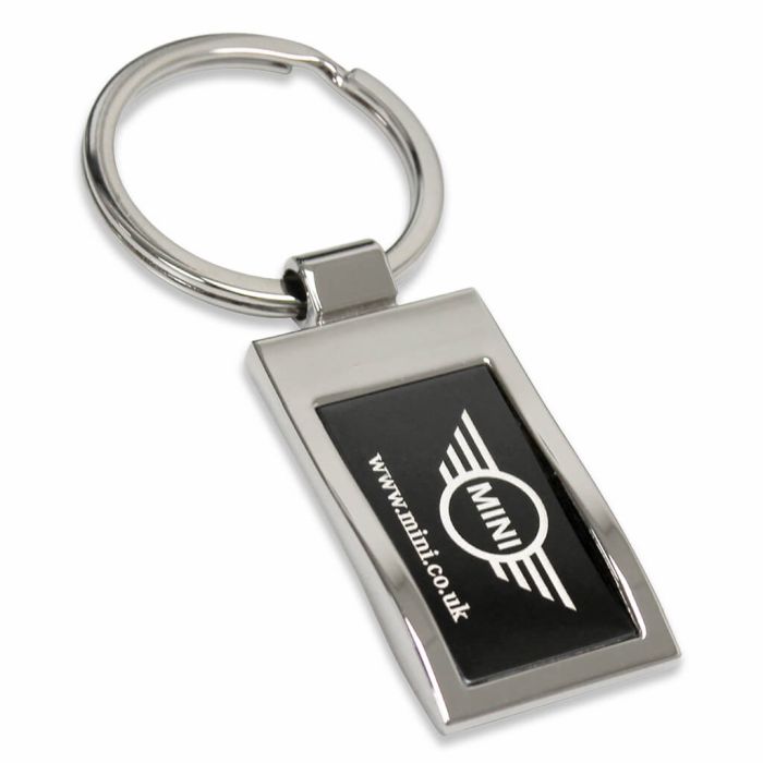 Custom metal keyring with a branded central piece.