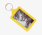 Yellow surround with full colour printed inserts. A cheap but highly practical re-openable keyring with stretchy sides.