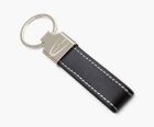 Custom keyring with engraved branding, strap made from PU leather and metal attachment.