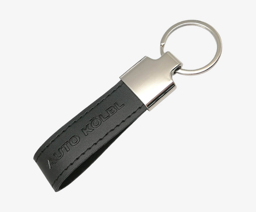 PU leather keyring with embossed branding.
