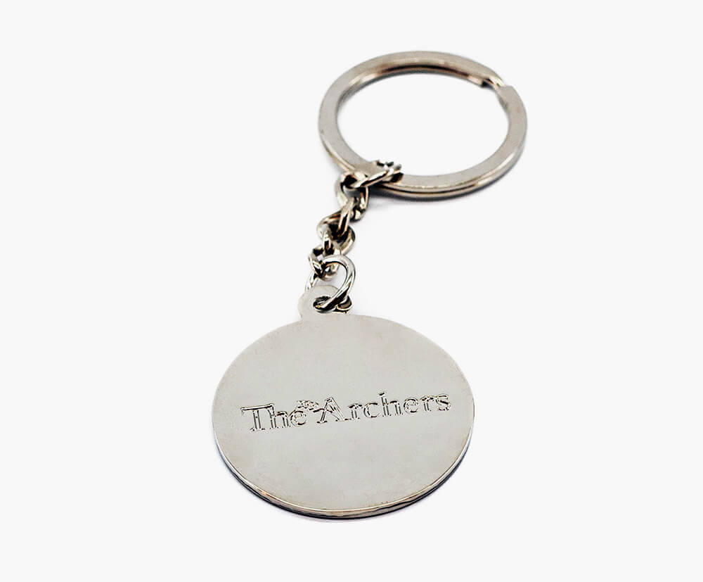 Custom metal keyring with a detailed embossed promotional design.