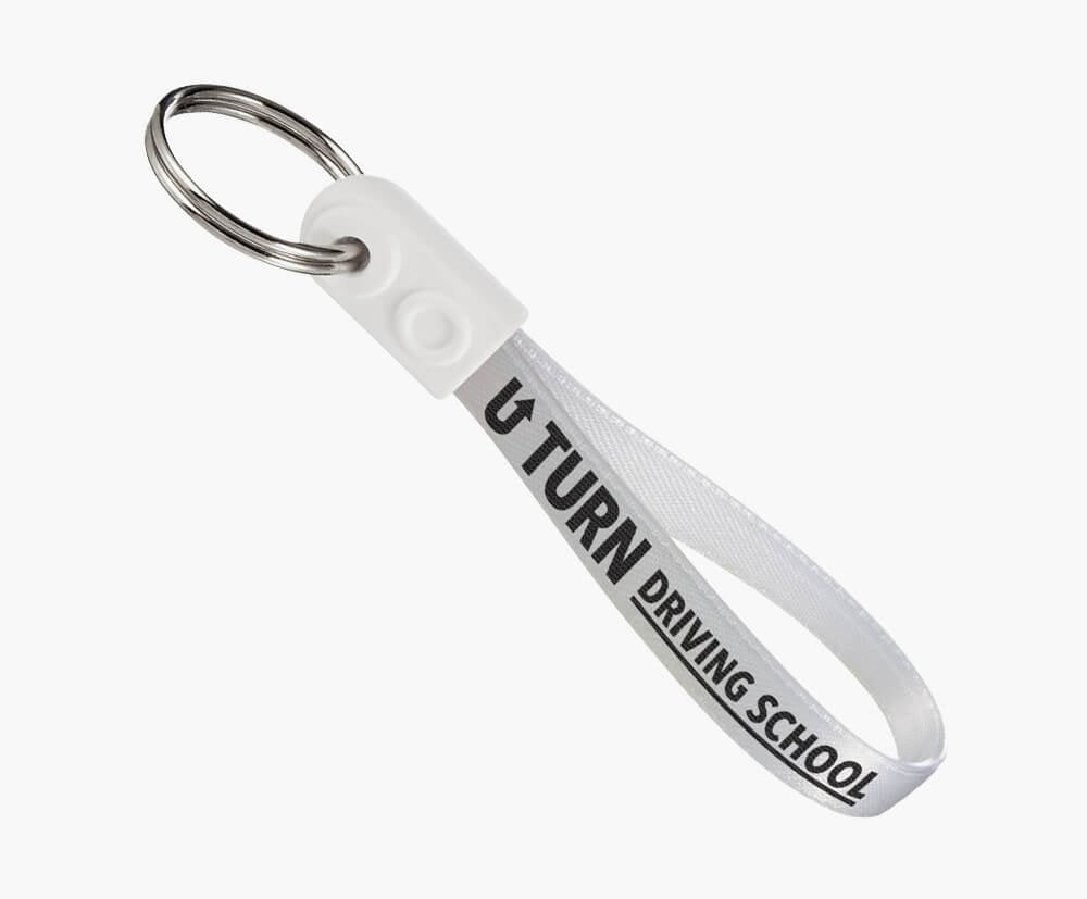 White ad-loop keyring. This example shows a white loop end, clear underside, black print on a white ribbon.