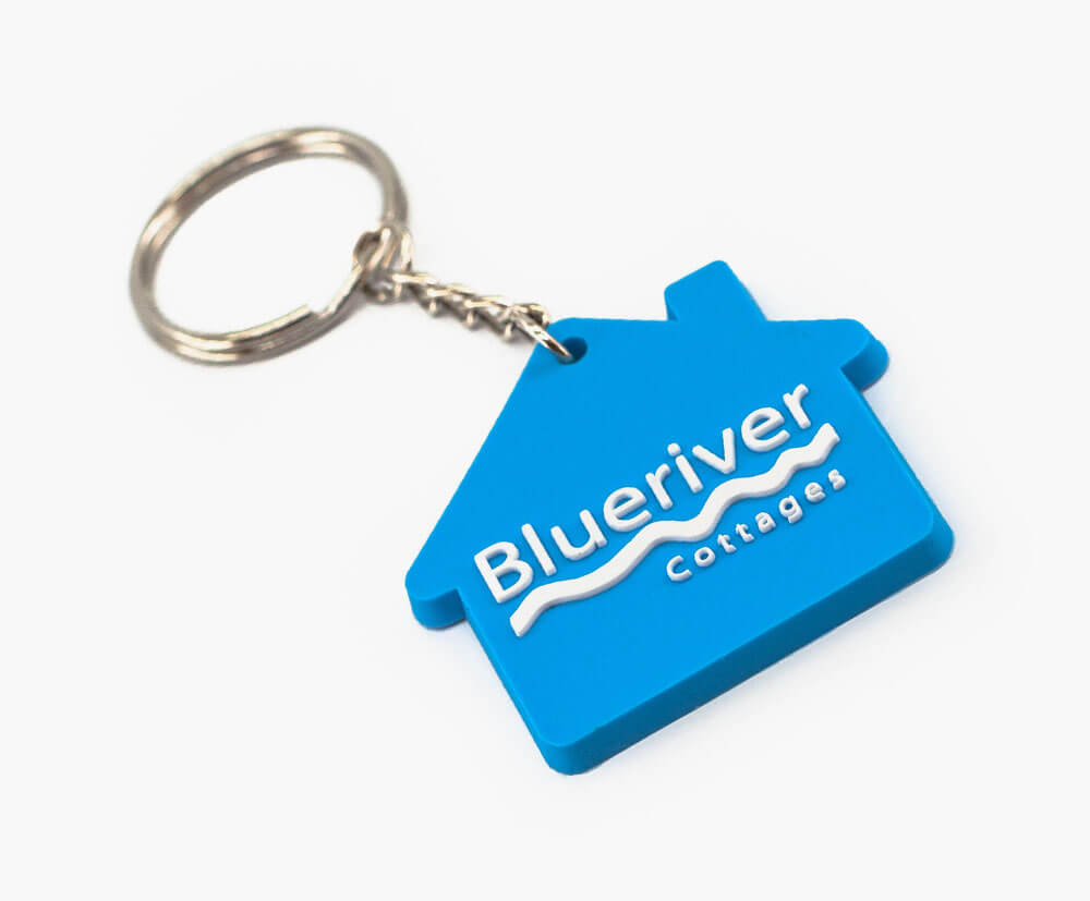 Blue house shaped soft PVC Keyrings in 2 colour pvc fill.