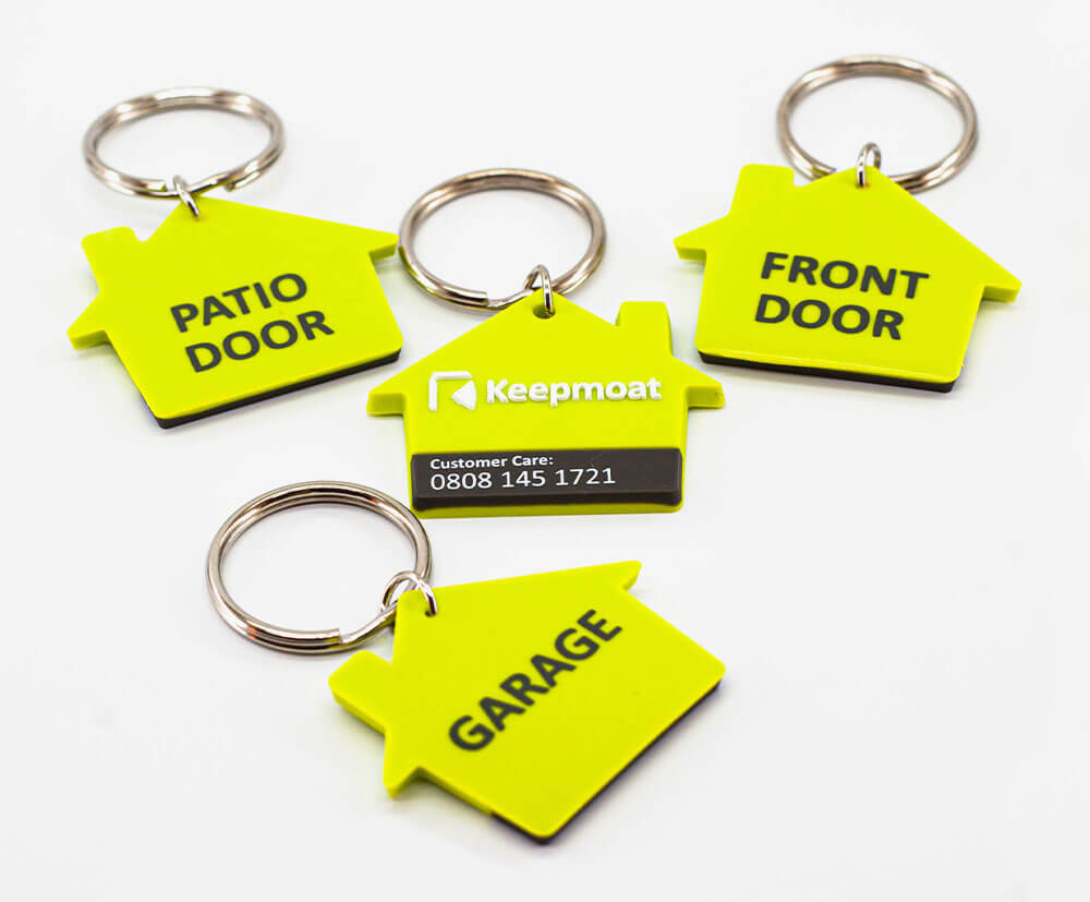 House shaped soft PVC/rubber style keyrings. Variable data in 1 colour print on reverse.