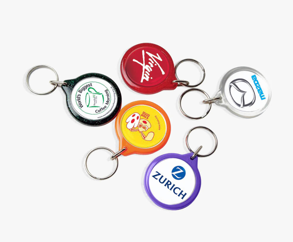 Full colour printed paper inserts within acrylic keyrings.