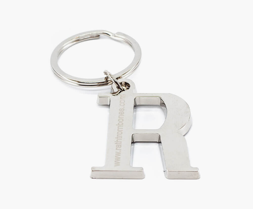 Engraving example on letter shaped silver keyring.
