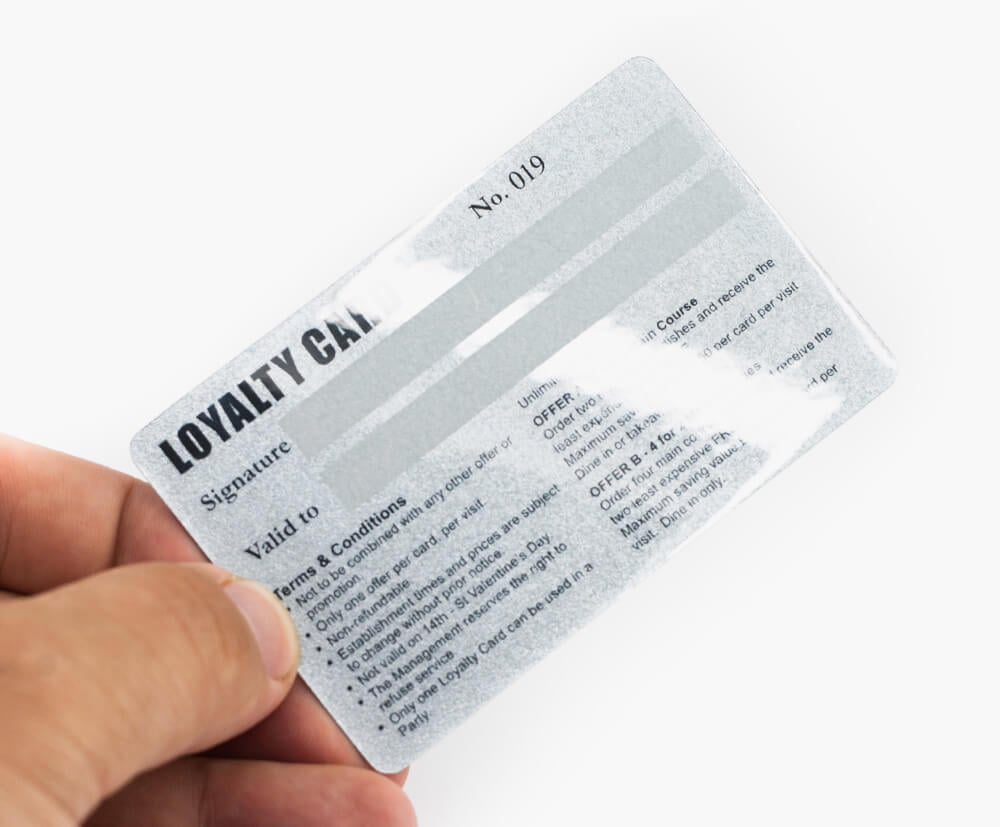 Add signature strips to 1 side of a promotional plastic card.