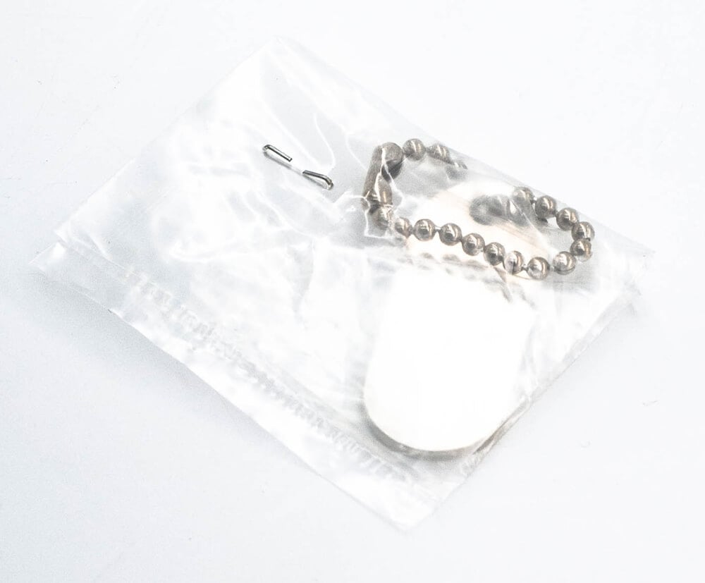 Plastic bags for individually packaged keyrings.
