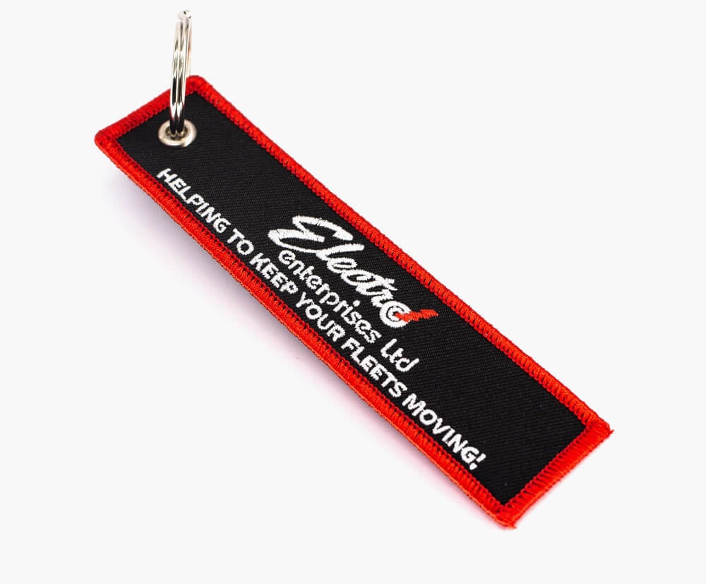 High-quality embroidery finish on a remove before flight tag custom branded with your details.