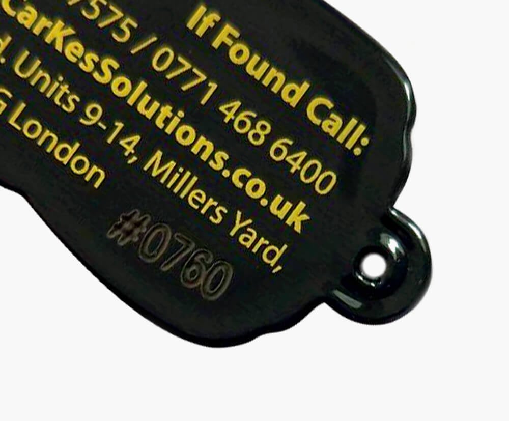 Black PVC keyrings engraved with sequential numbering on reverse.