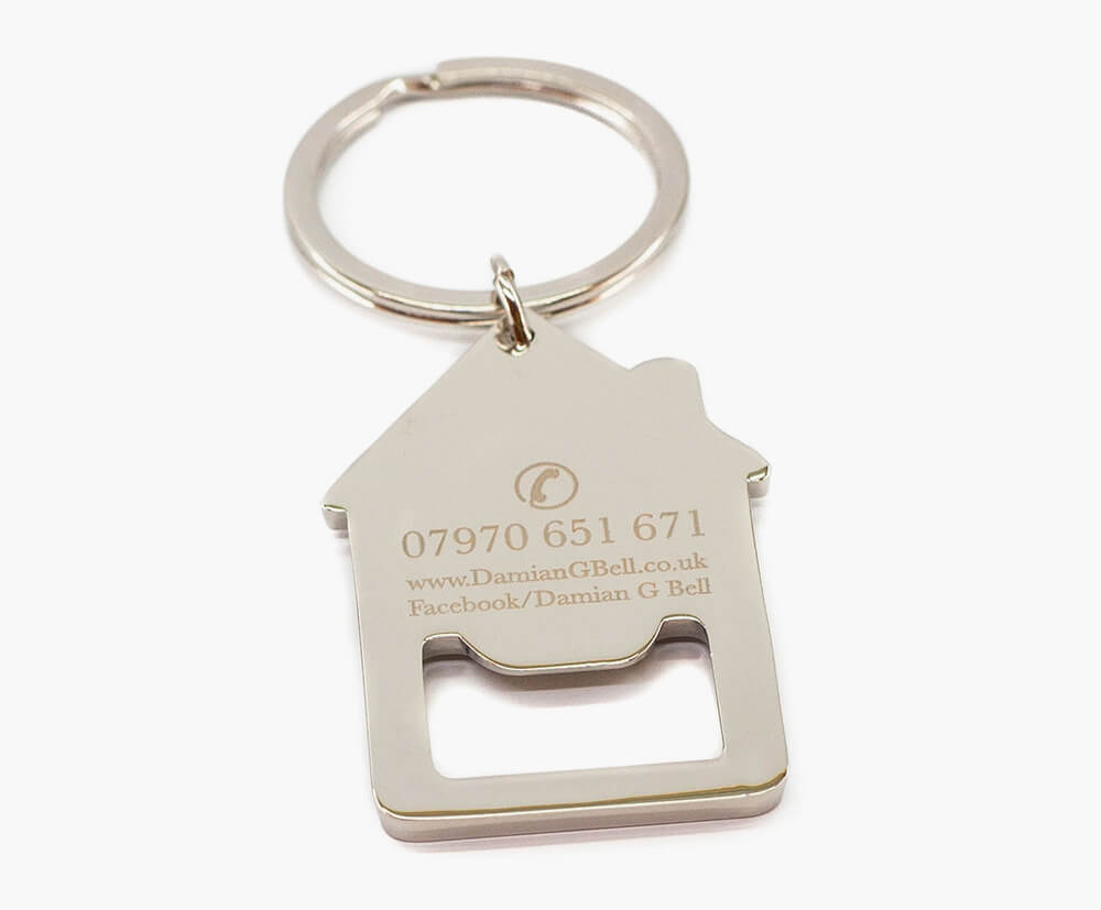 House shaped keyring with quality personalised engraving on front.