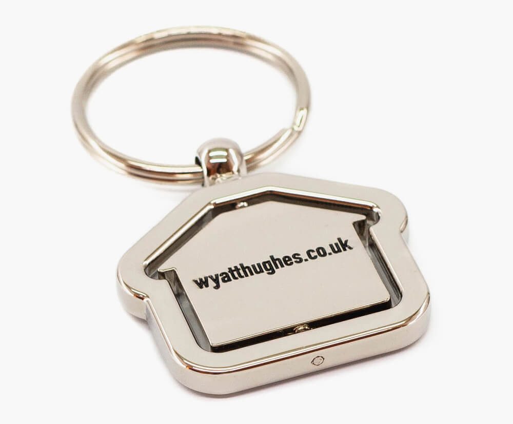 Silver-plated house-shaped promotional keyring.
