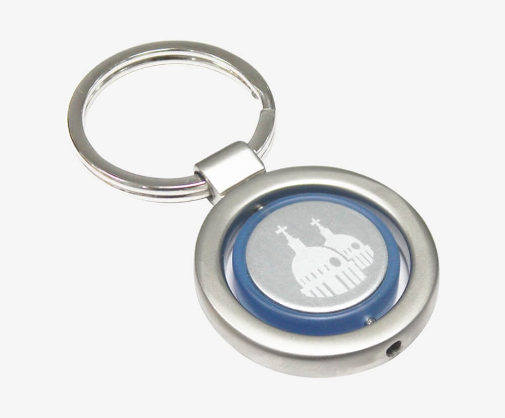 Custom metal keyring with an engraved central disc.