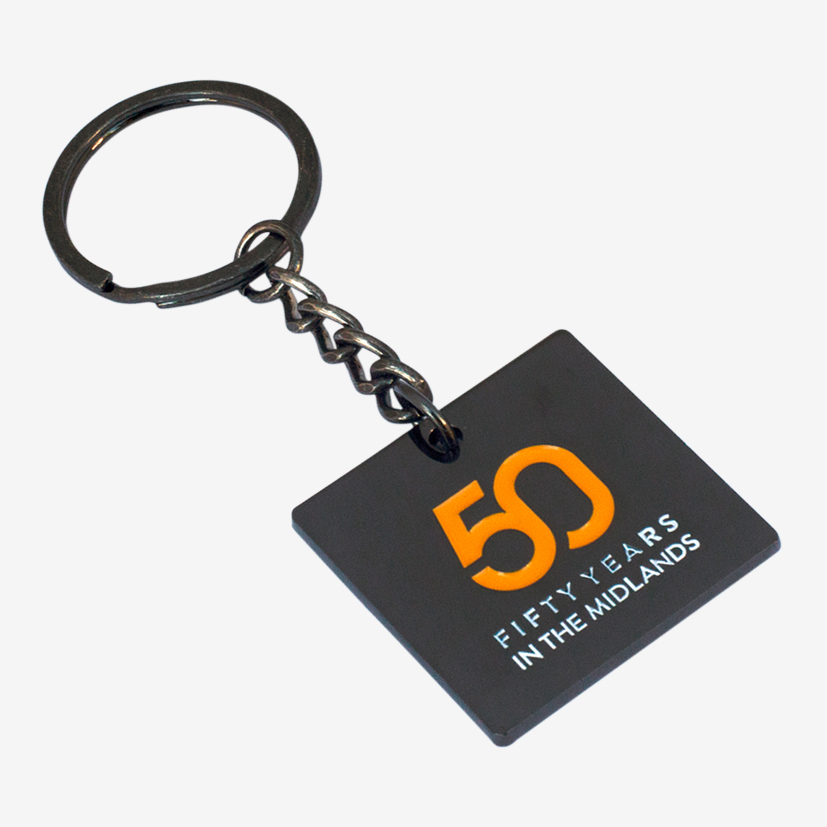 Black plated square metal keyrings with a business logo.