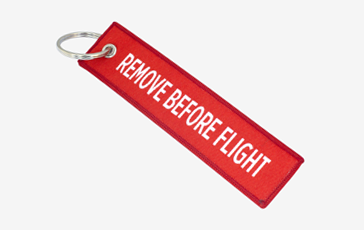 Custom branded remove before flight fabric keyrings